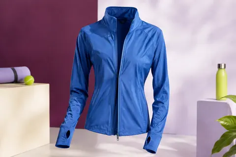 Veste de sport bleue à manches longues avec zip intégral et ouvertures pour les pouces